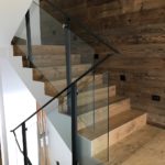 Parapetto scala in vetro con corrimano in ferro